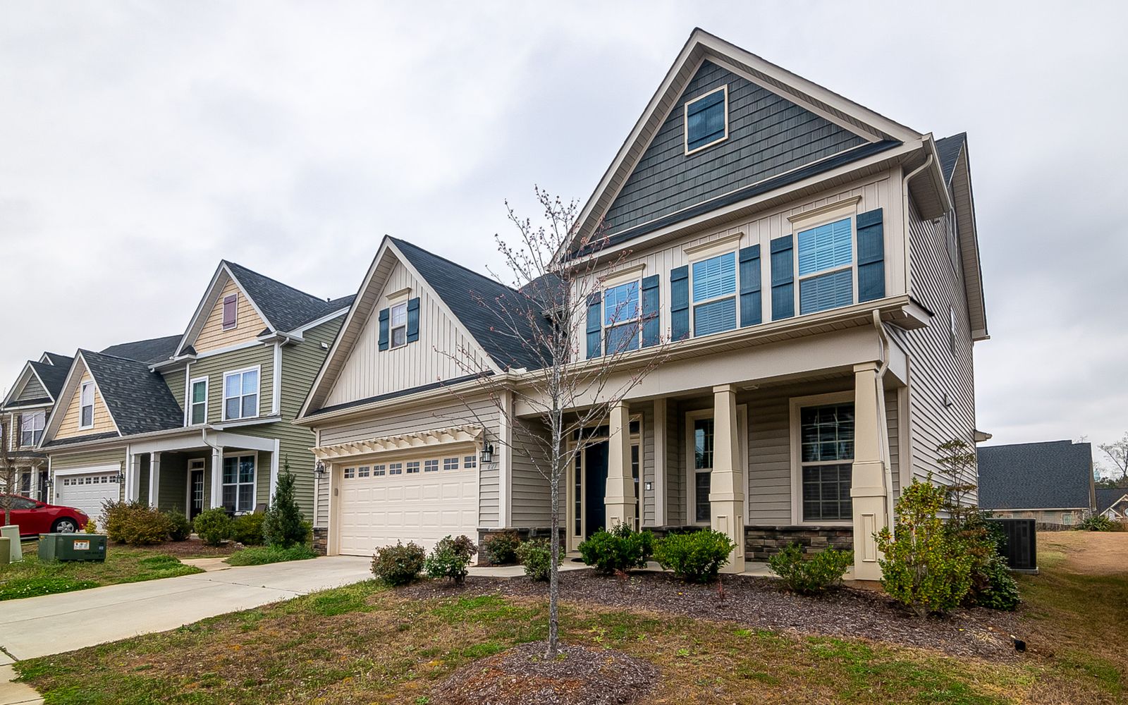 Two-story home with a covered front porch in English Ranch